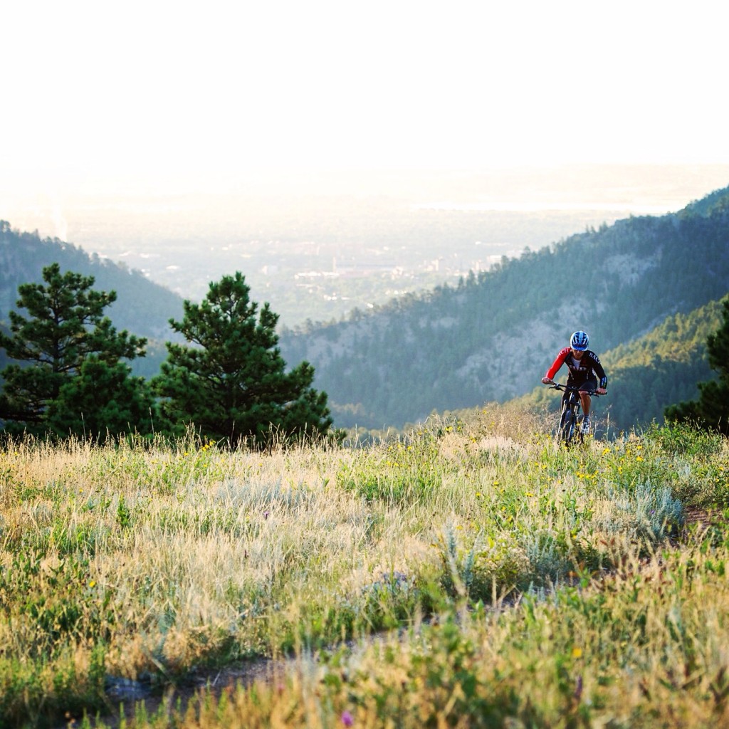 A rider mountain bikes at Betasso at sunrise, shot on assignment for the NY Times